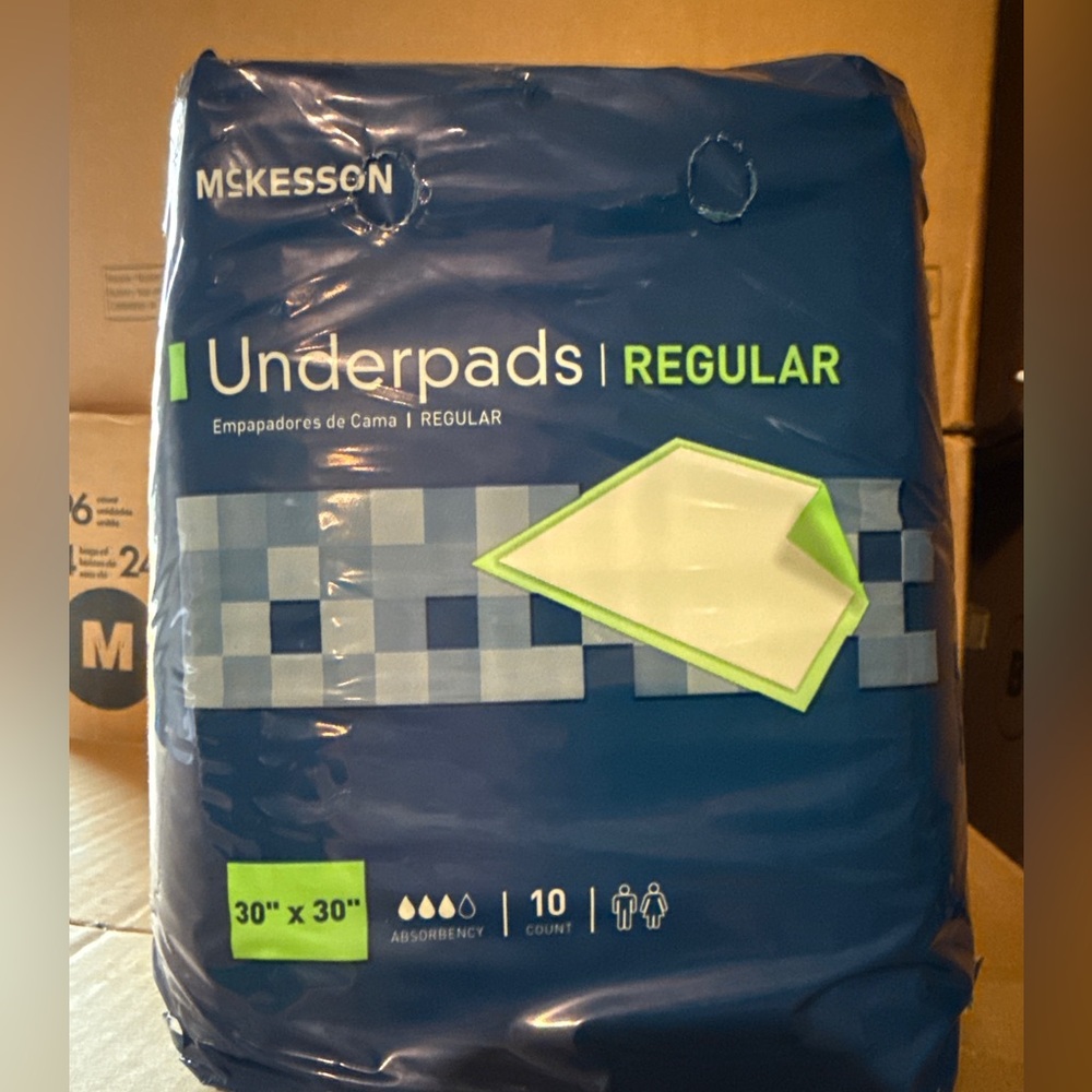 4 packs of McKesson Underpads Regular Size